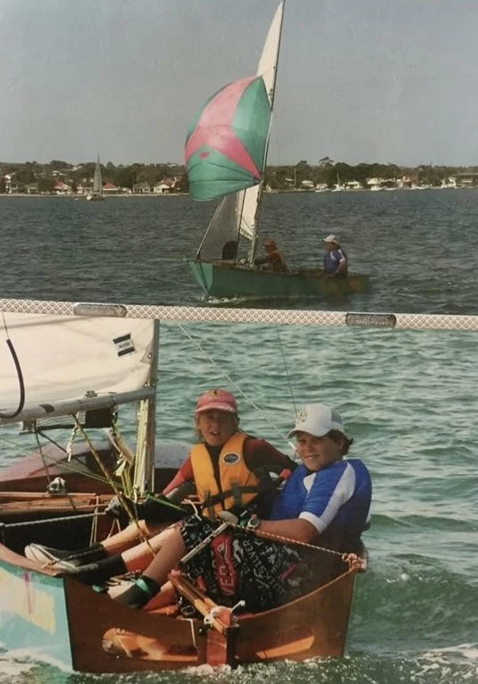 A page from the family photo album: children racing small sailing dinghies on Lake Macquarie